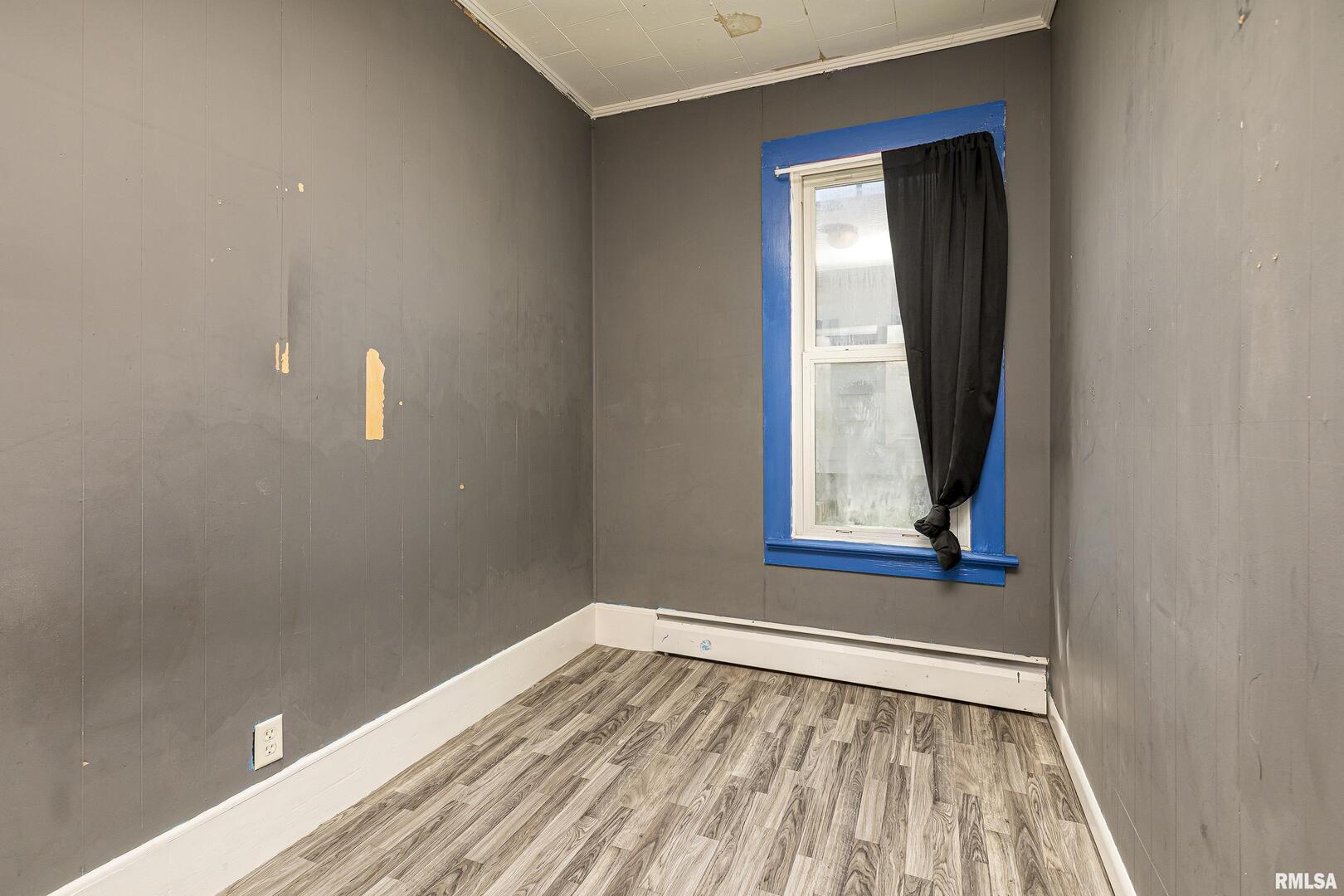 1500 West Tyler Street Herrin, IL 62948 - Photo 11 of 17 a view of a small space with wooden floor and a window