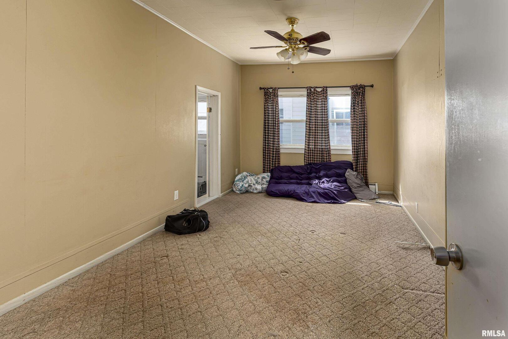 1500 West Tyler Street Herrin, IL 62948 - Photo 14 of 17 a man sitting in a room with window