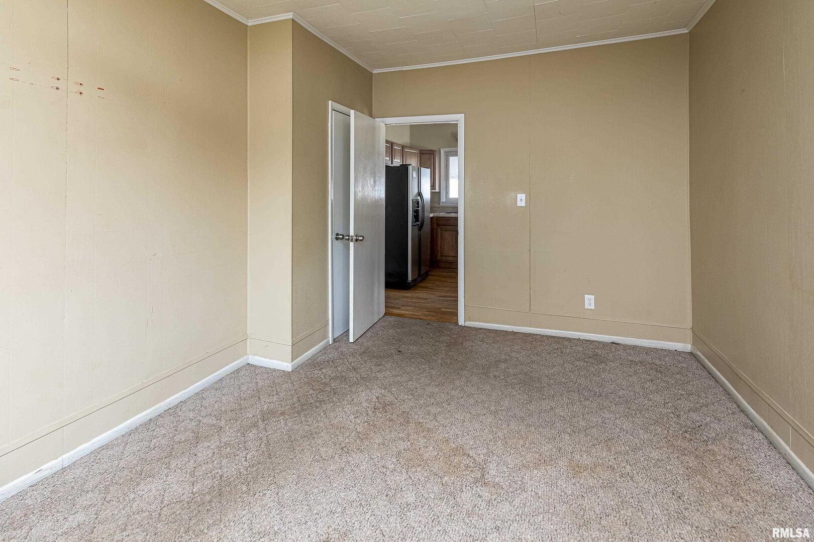 1500 West Tyler Street Herrin, IL 62948 - Photo 15 of 17 a view of an empty room with closet and a window