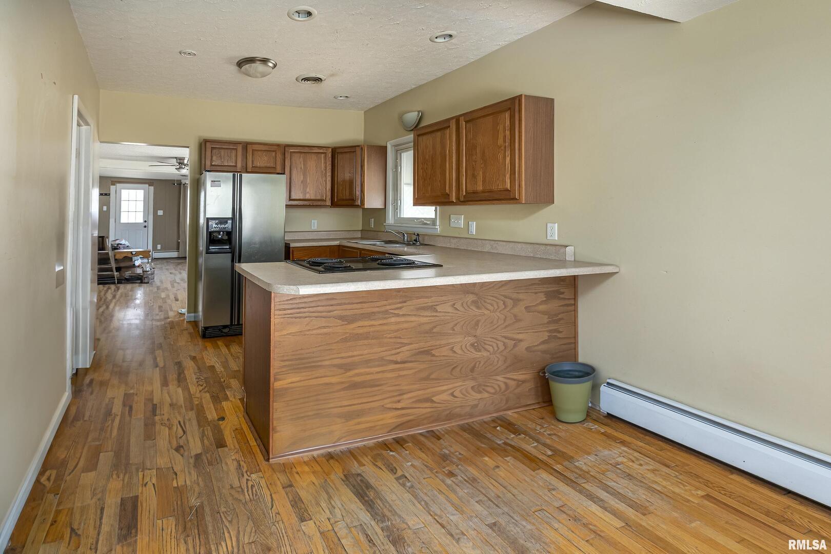 1500 West Tyler Street Herrin, IL 62948 - Photo 7 of 17 a kitchen with a sink and a stove top oven