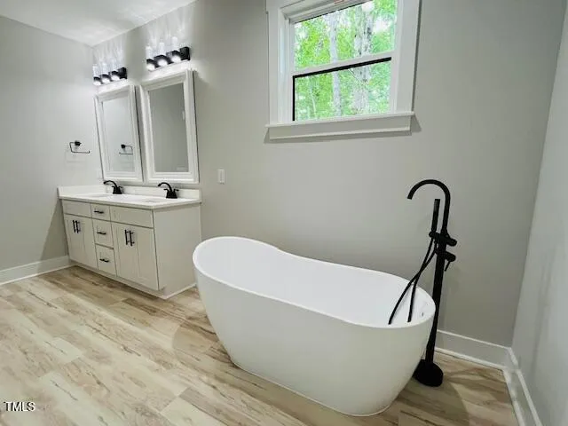 a bathroom with a bathtub and a sink