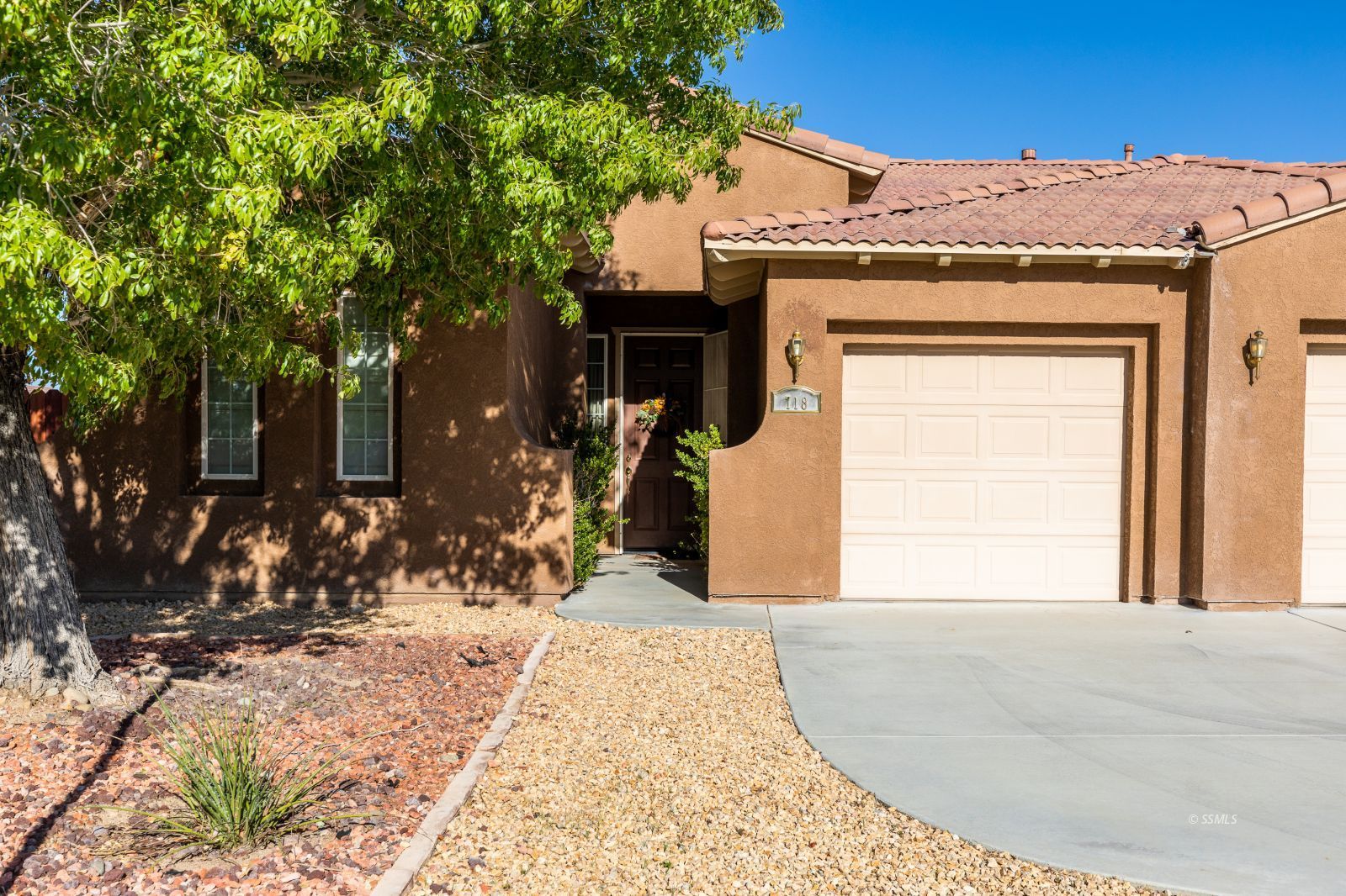 718 Pinon Court Ridgecrest, CA 93555 - Photo 2 of 41 a front view of a house with a yard