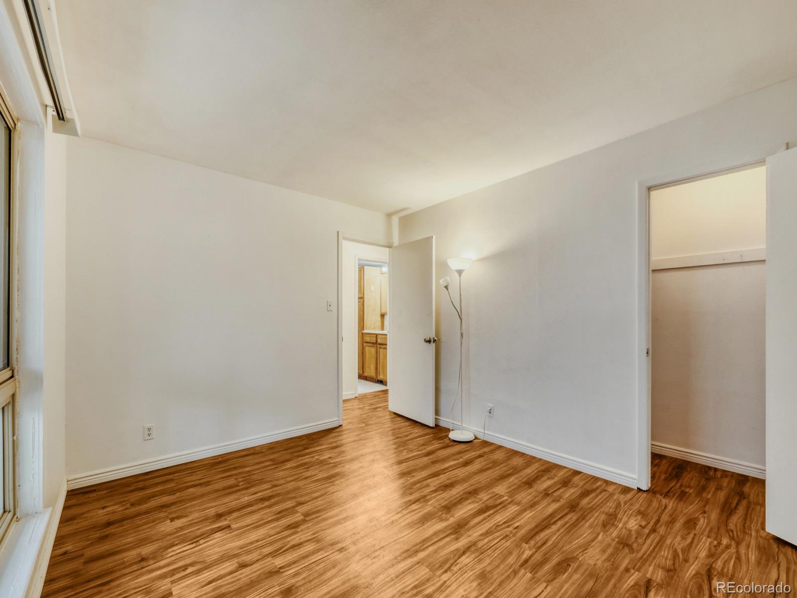 6495 East Happy Canyon Road, Unit 43 Denver, CO 80237 - Photo 13 of 28 a view of an empty room with wooden floor