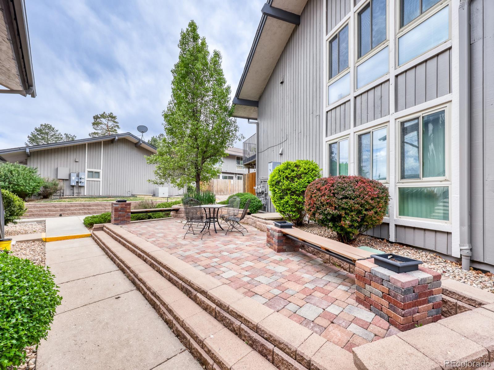 6495 East Happy Canyon Road, Unit 43 Denver, CO 80237 - Photo 22 of 28 a view of a house with backyard and sitting area