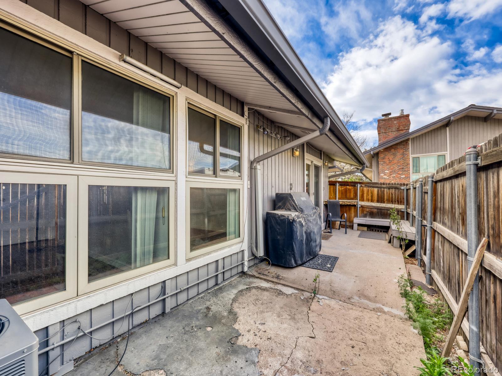 6495 East Happy Canyon Road, Unit 43 Denver, CO 80237 - Photo 24 of 28 a view of a house with porch and furniture