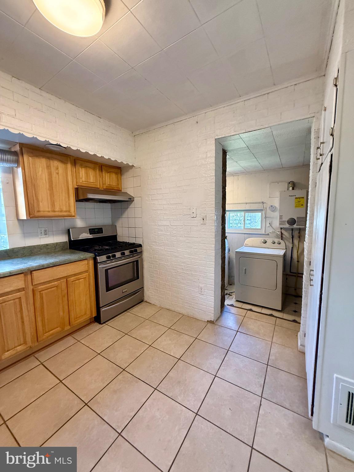403 South Main Street Ambler, PA 19002 - Photo 13 of 37 a kitchen with a sink a stove and cabinets