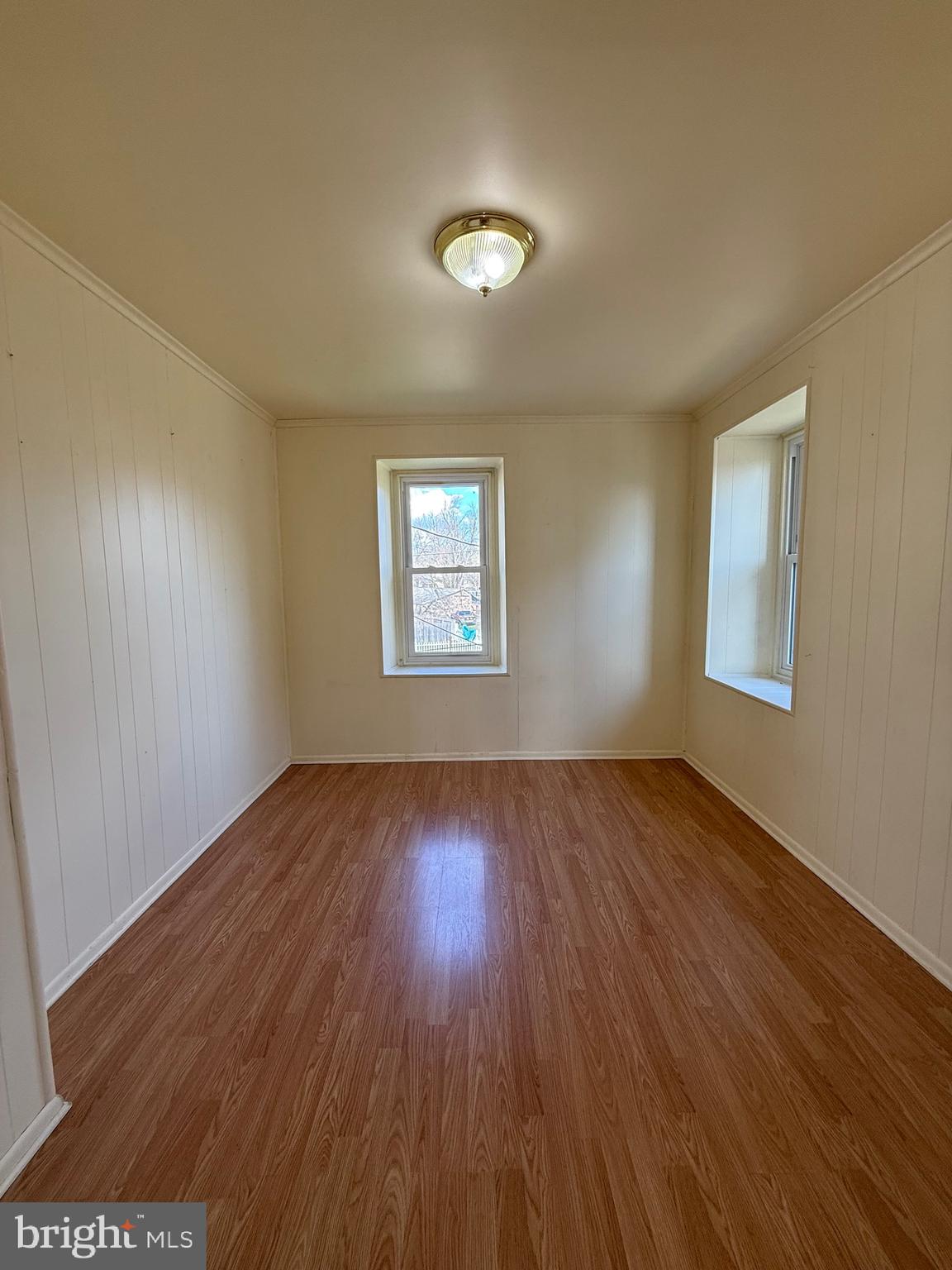 403 South Main Street Ambler, PA 19002 - Photo 20 of 37 an empty room with wooden floor and windows