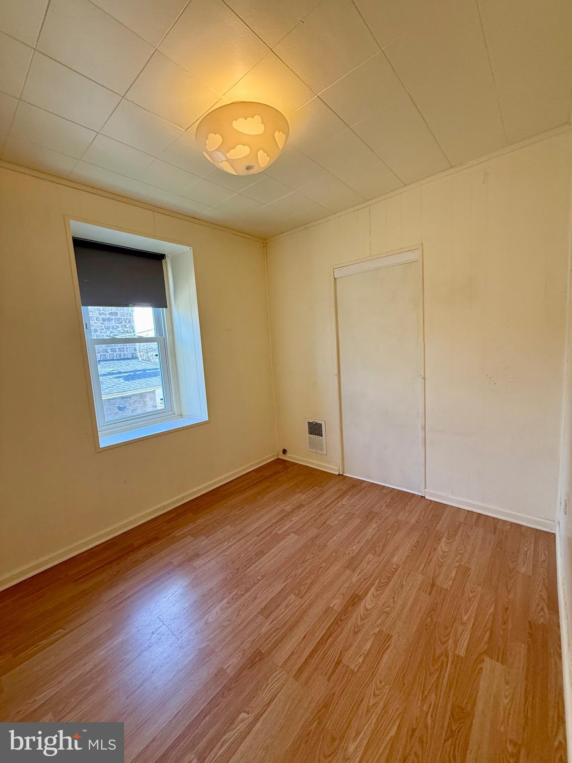 403 South Main Street Ambler, PA 19002 - Photo 25 of 37 an empty room with wooden floor and windows
