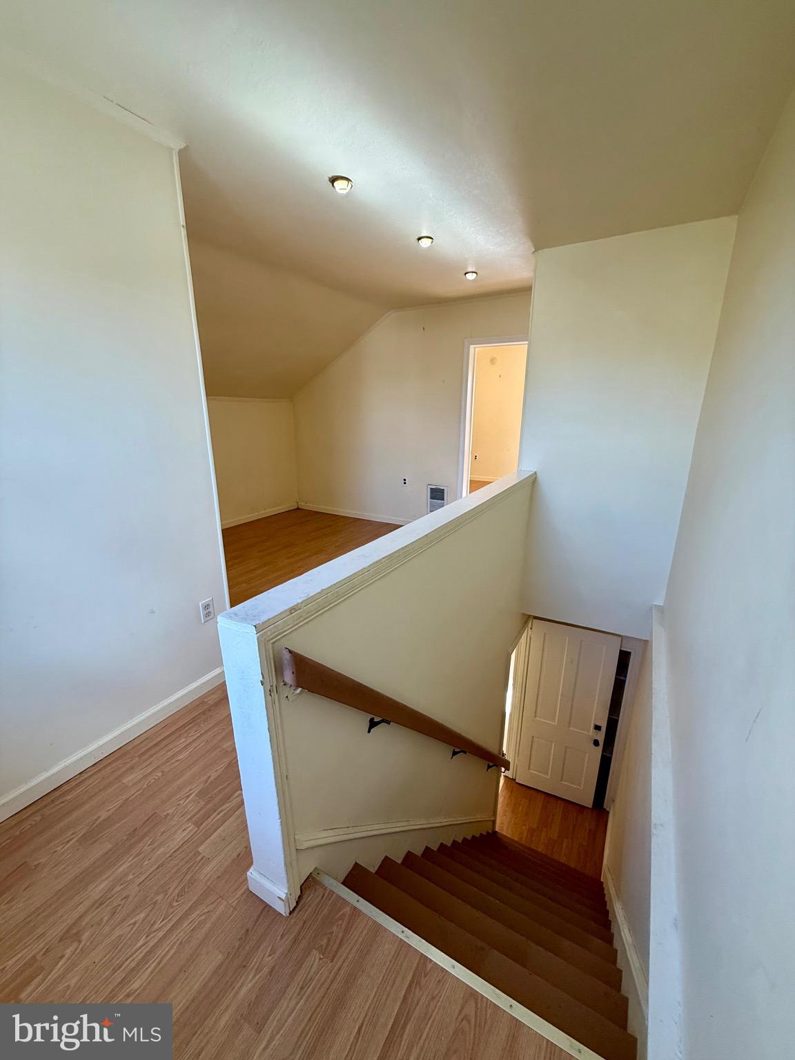 403 South Main Street Ambler, PA 19002 - Photo 28 of 37 a view of an empty room with wooden floor and chair