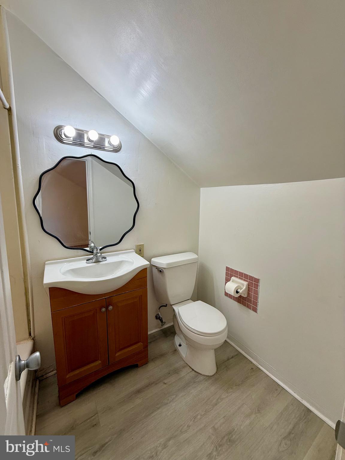403 South Main Street Ambler, PA 19002 - Photo 31 of 37 a bathroom with a toilet a sink and a mirror