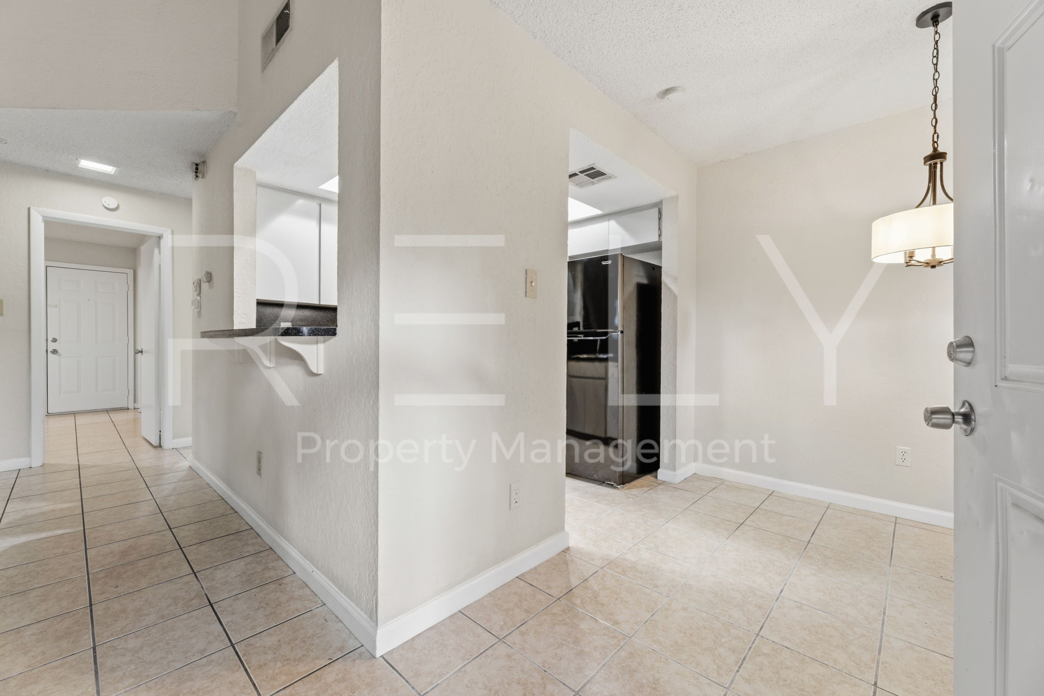 1005 Milford Way, Unit A Austin, TX 78745 - Photo 8 of 30 wooden floor with white cabinets