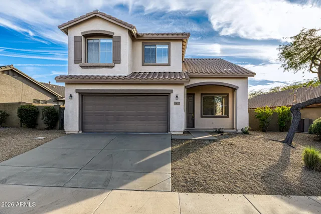 a front view of a house with yard