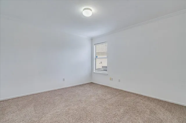 a bathroom with a sink a toilet and shower curtain