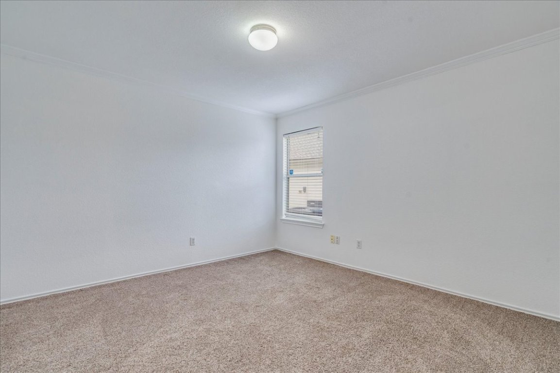 18436 Wind Tree Lane Elgin, TX 78621 - Photo 10 of 34 an empty room with a empty space and window