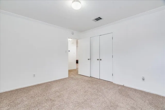 an empty room with a empty space and windows