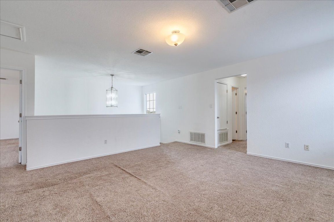 18436 Wind Tree Lane Elgin, TX 78621 - Photo 14 of 34 Unfurnished room featuring tons of space & light carpet