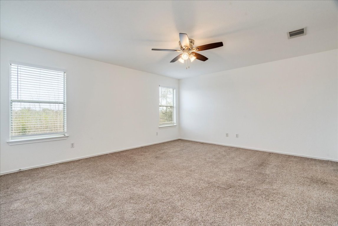 18436 Wind Tree Lane Elgin, TX 78621 - Photo 15 of 34 a view of an empty room with a window