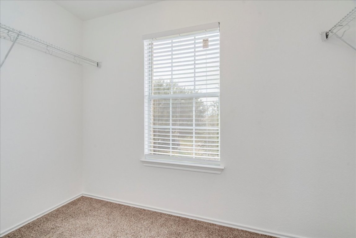 18436 Wind Tree Lane Elgin, TX 78621 - Photo 19 of 34 a small space with a window
