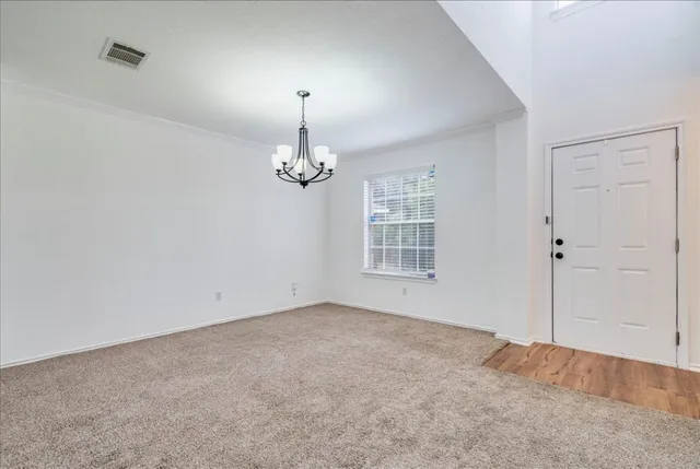 a view of empty room with windows