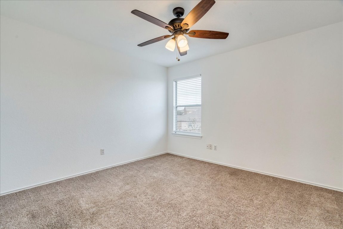 18436 Wind Tree Lane Elgin, TX 78621 - Photo 20 of 34 a view of an empty room with a window