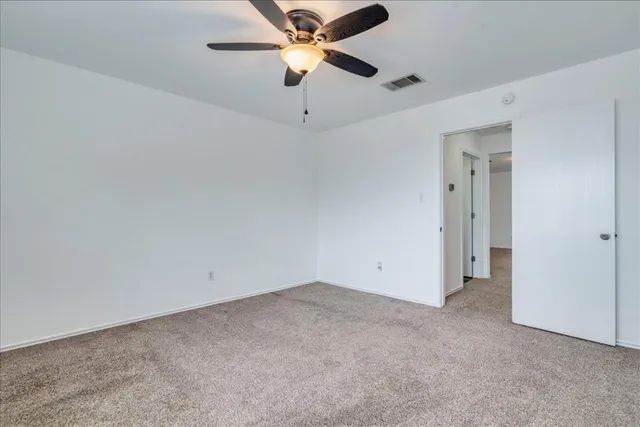 a front view of a house with a yard and a garage