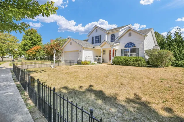 a view of house with yard and street view