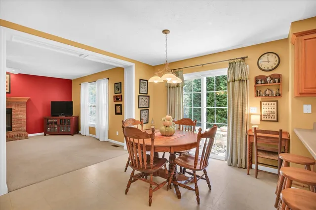 a dining room with furniture and window