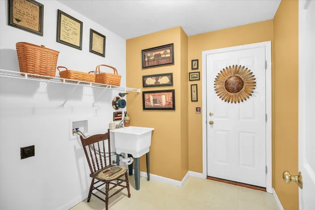 a view of a livingroom with furniture and entryway