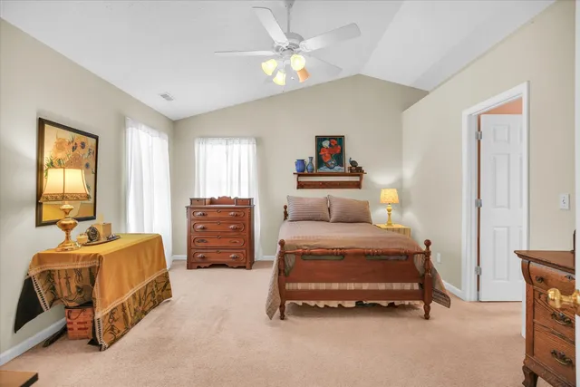 a bedroom with furniture and a chandelier