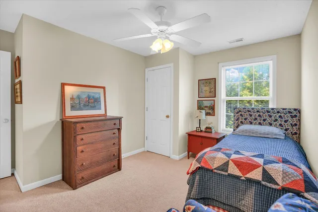 a bedroom with a bed and furniture