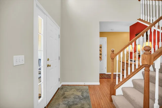 a view of an entryway with wooden floor