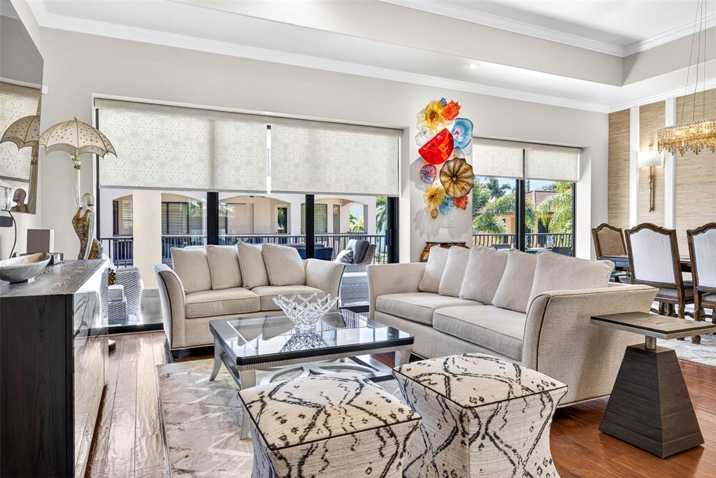105 Wimbledon Court Redington Shores, FL 33708 - Photo 18 of 89 a living room with furniture or couch and a wooden floor