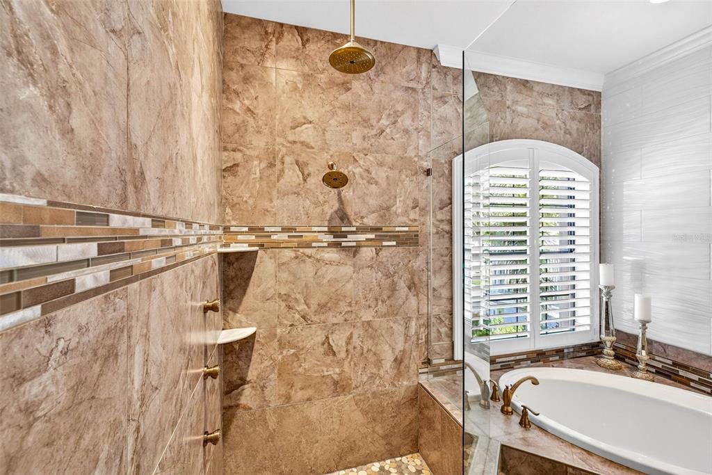 105 Wimbledon Court Redington Shores, FL 33708 - Photo 30 of 89 a bathroom with a granite countertop sink a mirror and a shower