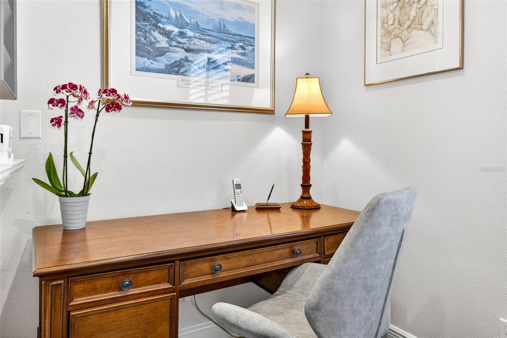 105 Wimbledon Court Redington Shores, FL 33708 - Photo 35 of 89 a room with table and a potted plant