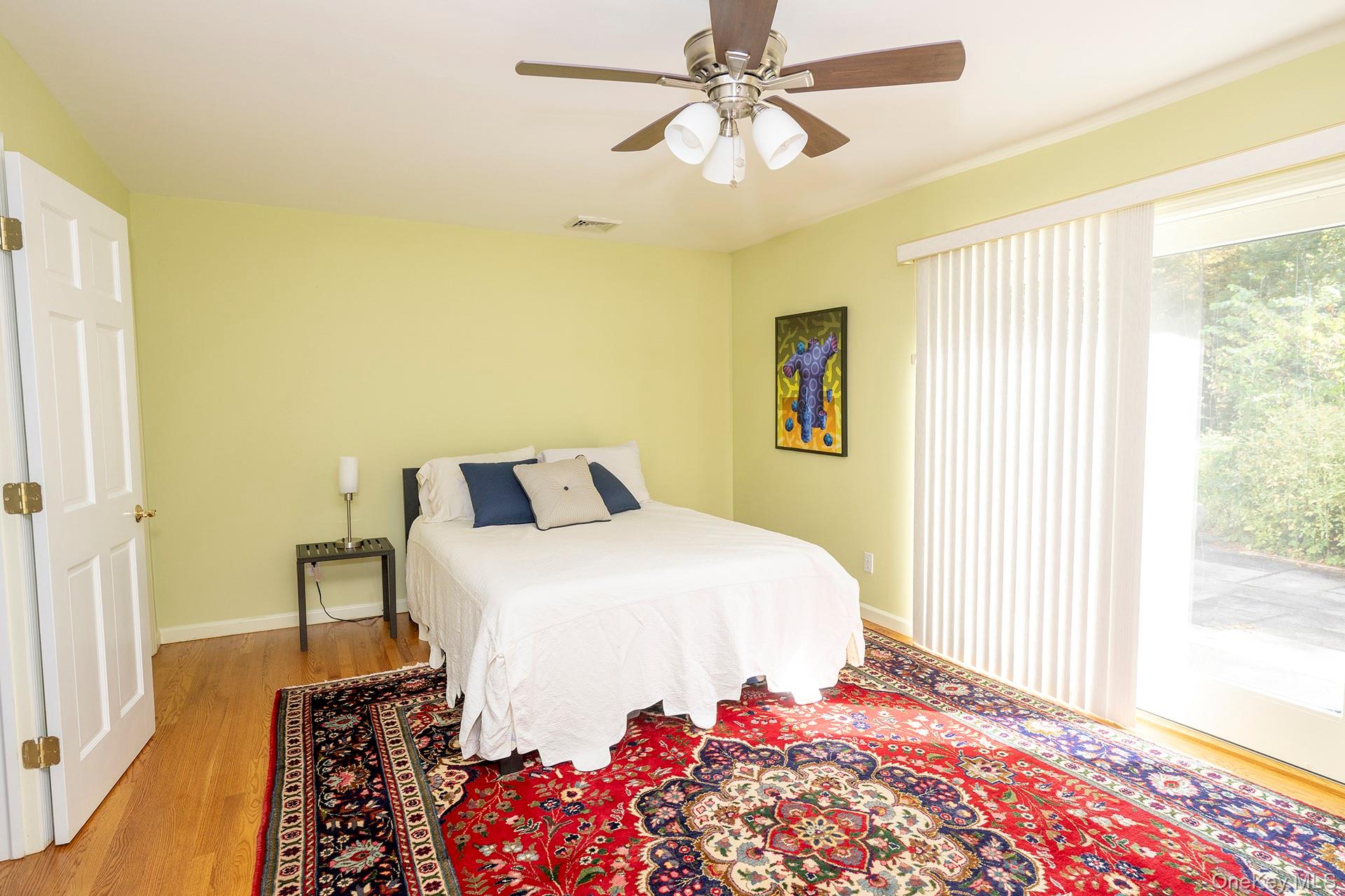 28 Clinton Corners Road Salt Point, NY 12578 - Photo 17 of 41 a bedroom with a bed and a chandelier