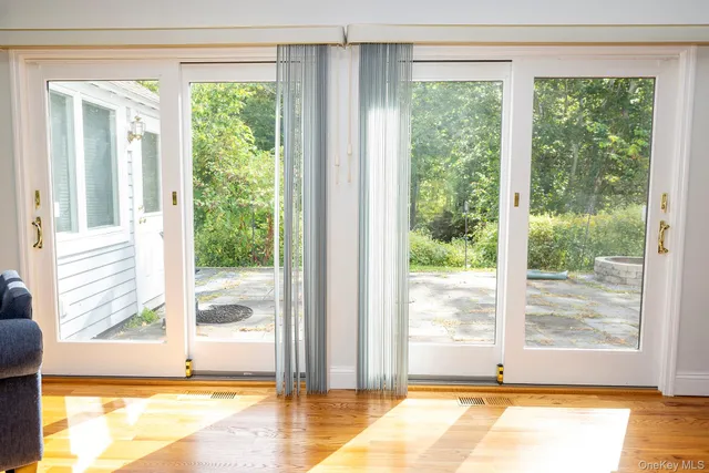 a view of a room that has a large window