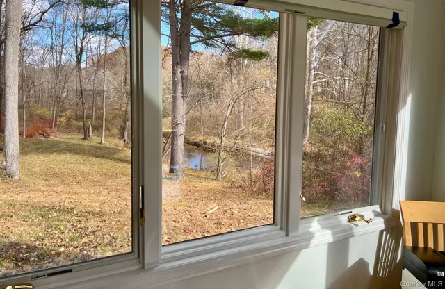a view of a large window with wooden floor