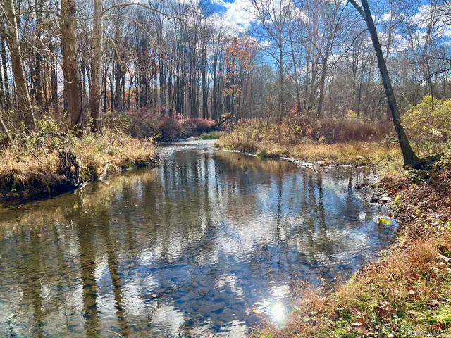 a view of lake with a yard
