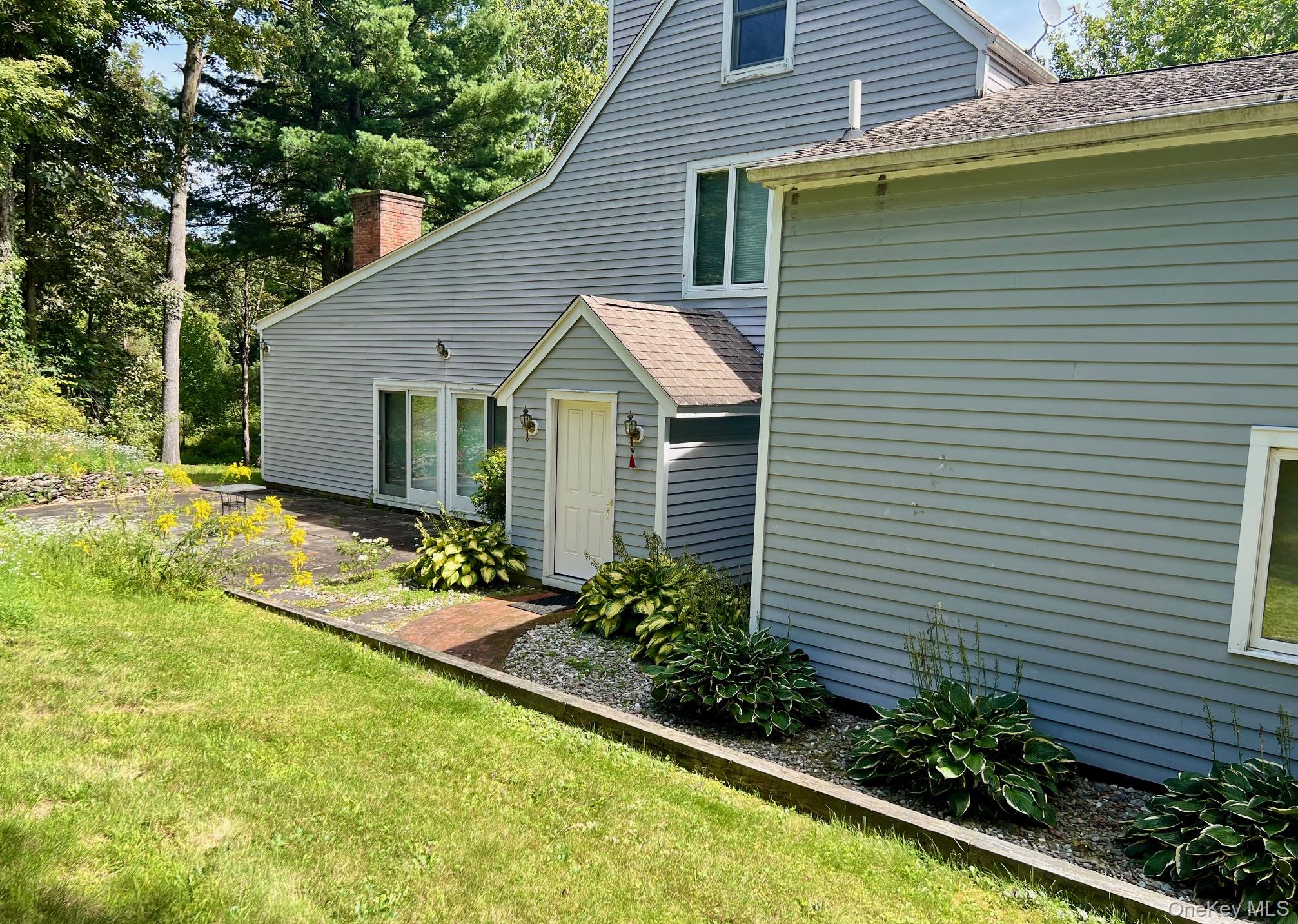 28 Clinton Corners Road Salt Point, NY 12578 - Photo 4 of 41 a view of a house with a yard and potted plants