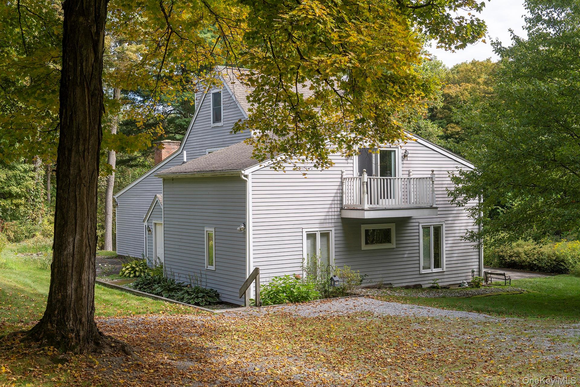 28 Clinton Corners Road Salt Point, NY 12578 - Photo 5 of 41 a front view of a house with a yard and garage