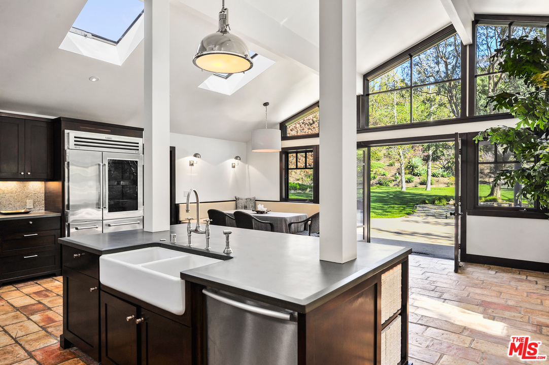 6172 Bonsall Drive Malibu, CA 90265 - Photo 18 of 40 a kitchen with a sink and wooden floor