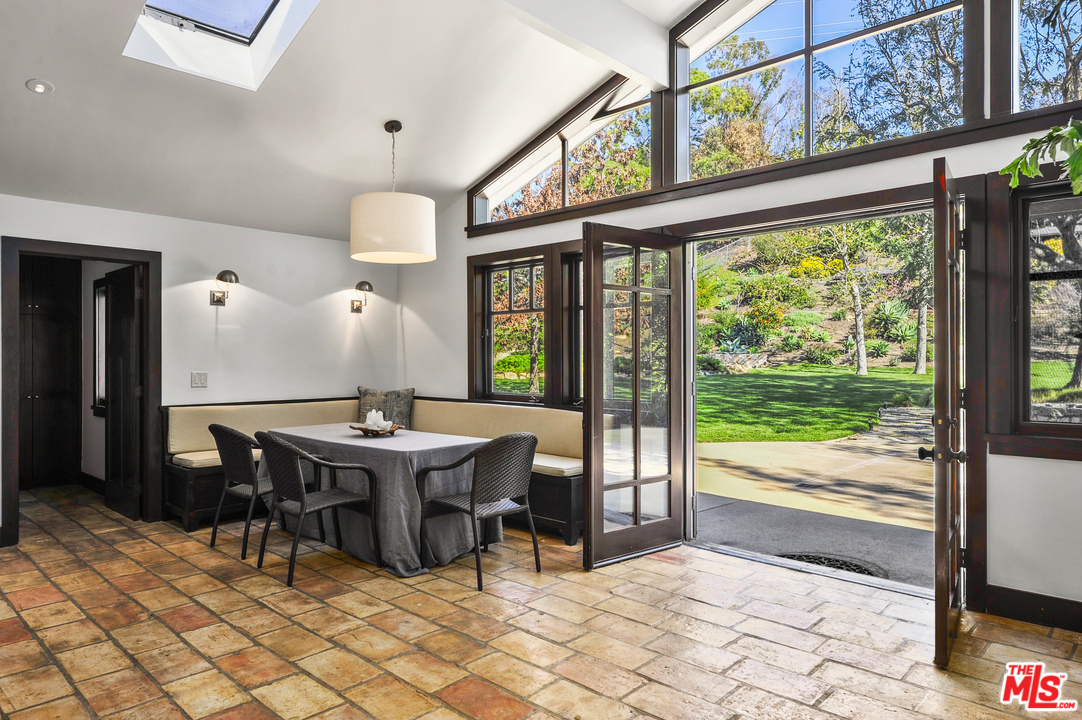 6172 Bonsall Drive Malibu, CA 90265 - Photo 19 of 40 a view of a dining room with furniture window and outside view