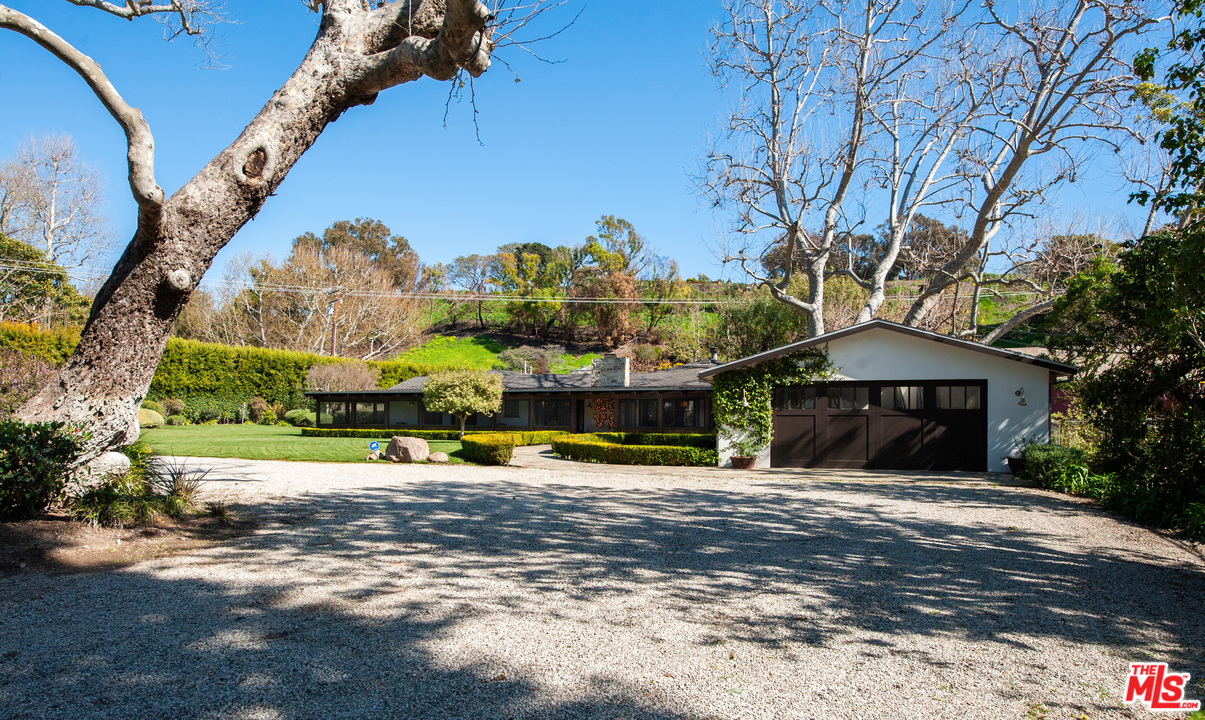 6172 Bonsall Drive Malibu, CA 90265 - Photo 3 of 40 a view of a house with a yard