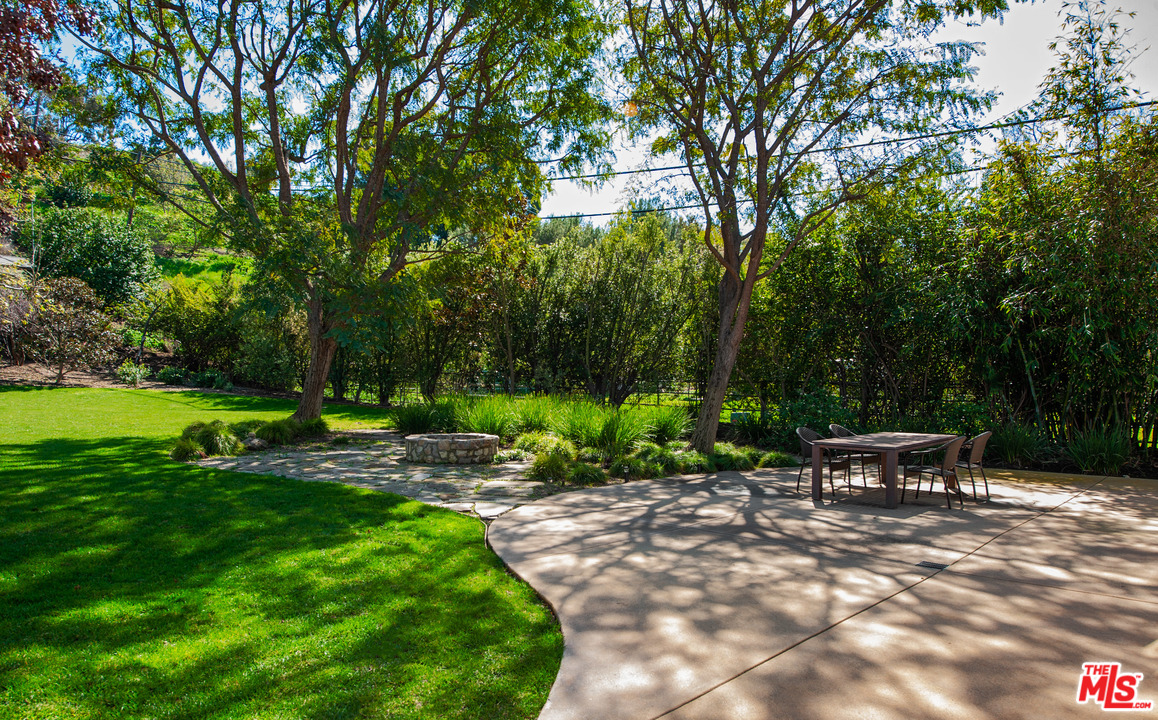 6172 Bonsall Drive Malibu, CA 90265 - Photo 27 of 40 a view of a bench in a garden