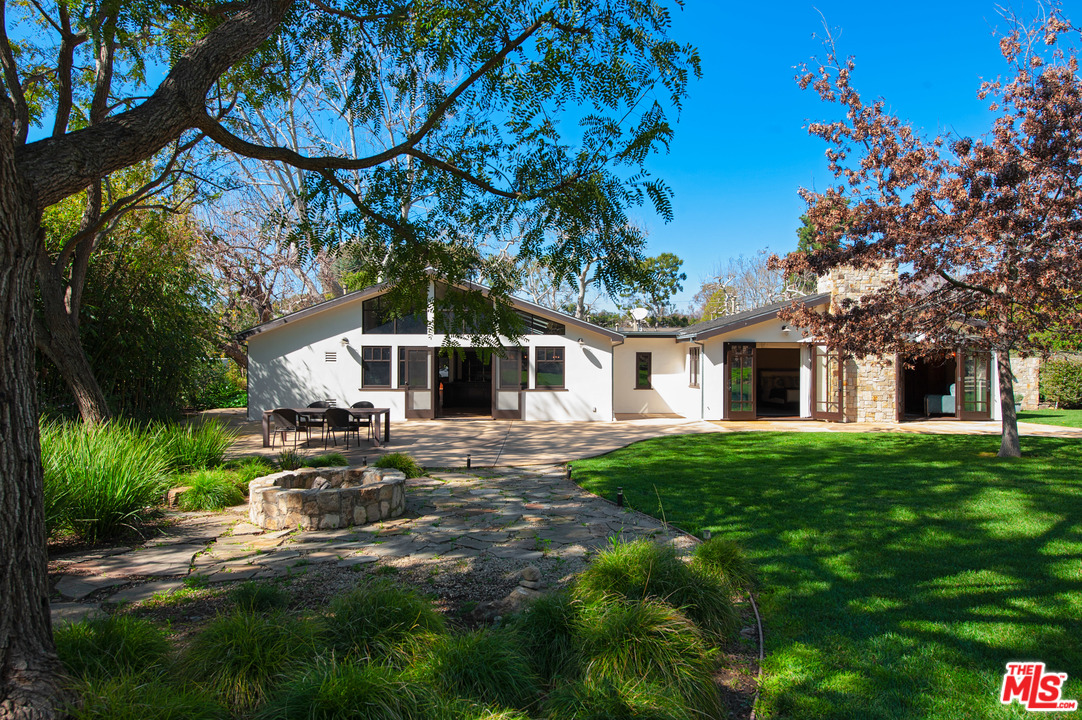 6172 Bonsall Drive Malibu, CA 90265 - Photo 29 of 40 a view of a house with a yard