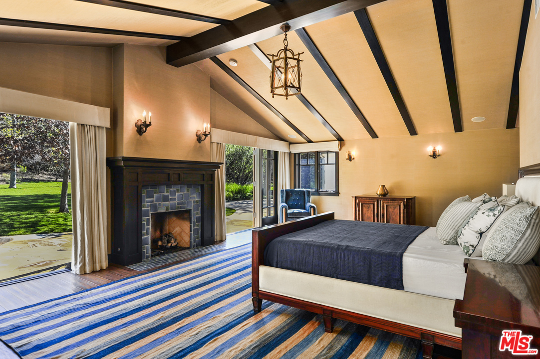 6172 Bonsall Drive Malibu, CA 90265 - Photo 32 of 40 a living room with furniture and a fireplace