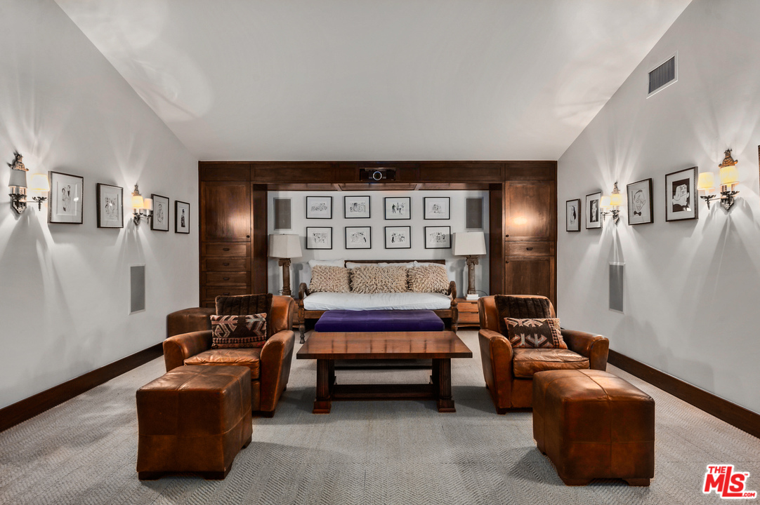 6172 Bonsall Drive Malibu, CA 90265 - Photo 40 of 40 a bedroom with furniture and a lamp