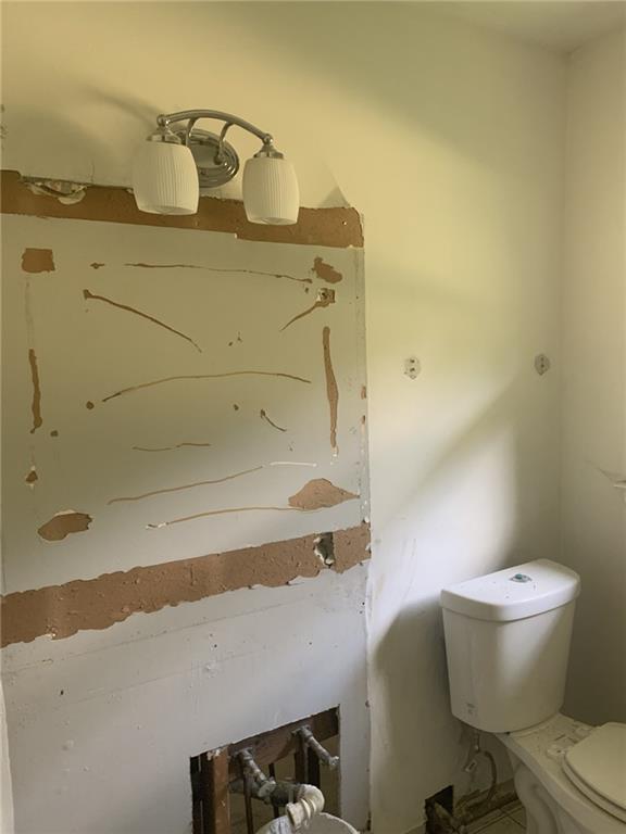 529 Hawkins Store Road Northeast Kennesaw, GA 30144 - Photo 12 of 18 a bathroom with a sink and a toilet