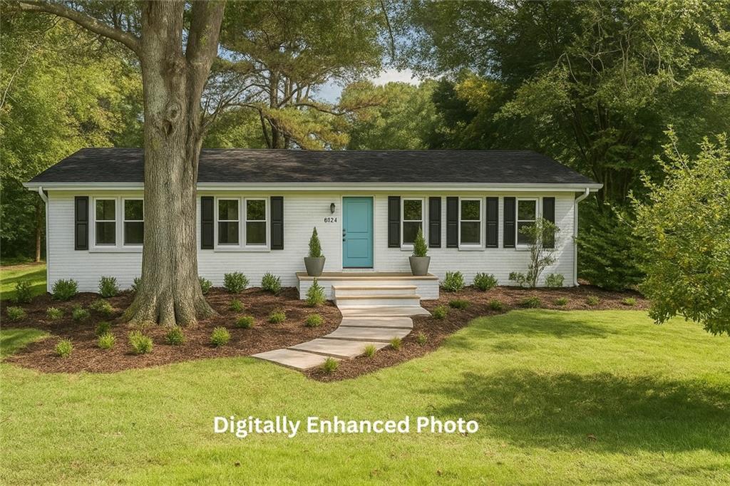 529 Hawkins Store Road Northeast Kennesaw, GA 30144 - Photo 2 of 18 a front view of house with yard and green space
