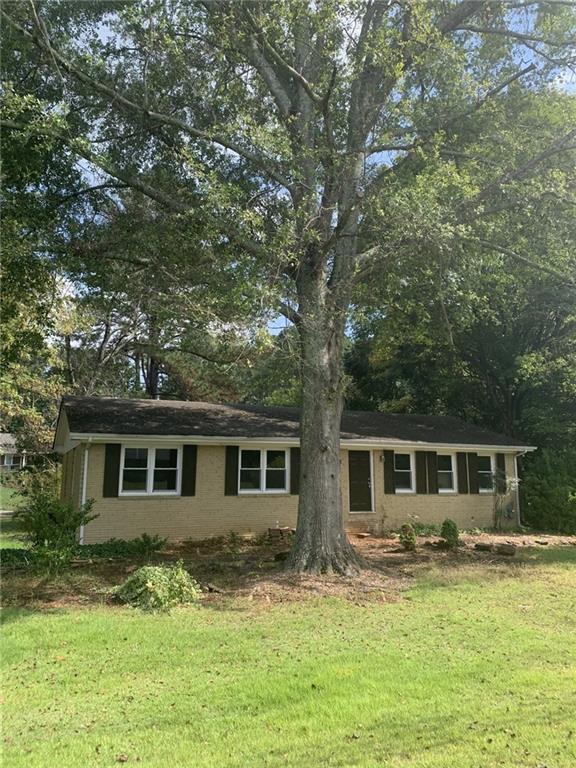 529 Hawkins Store Road Northeast Kennesaw, GA 30144 - Photo 3 of 18 front view of a house with a yard